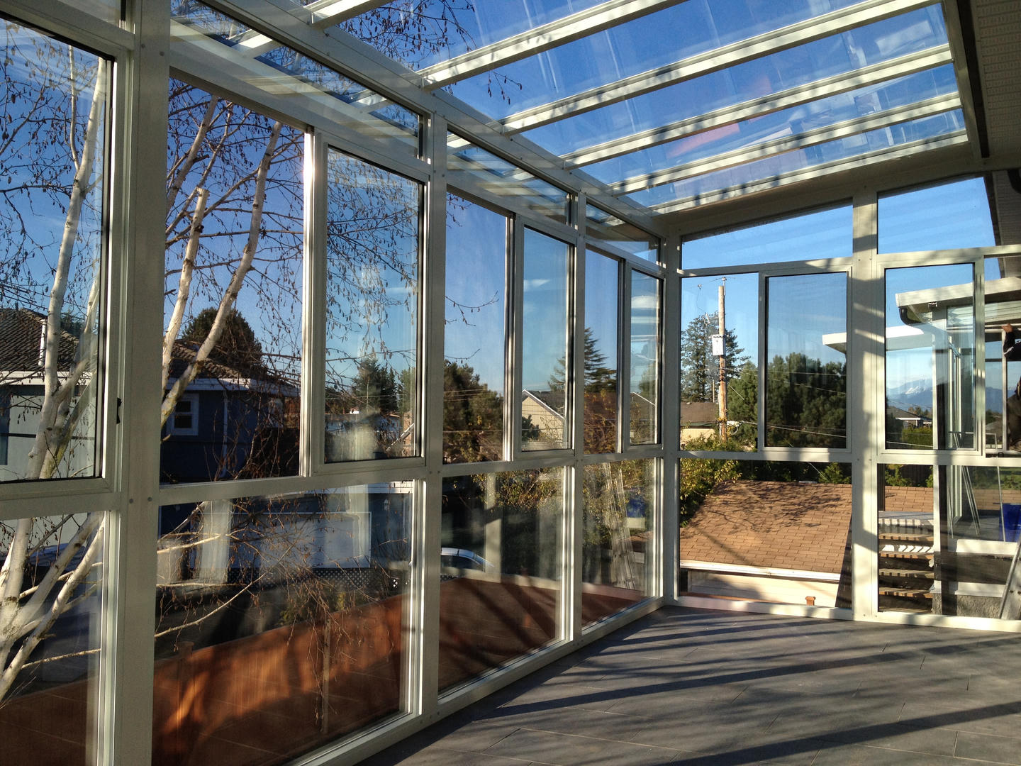 Interior of sunroom with white aluminum beams